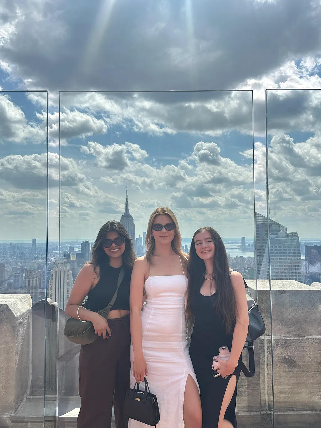 Picture of Alethea de Melo (left), Julia Kras (middle) and Marlena Morgowska (right) from Top of the Rok in NYC