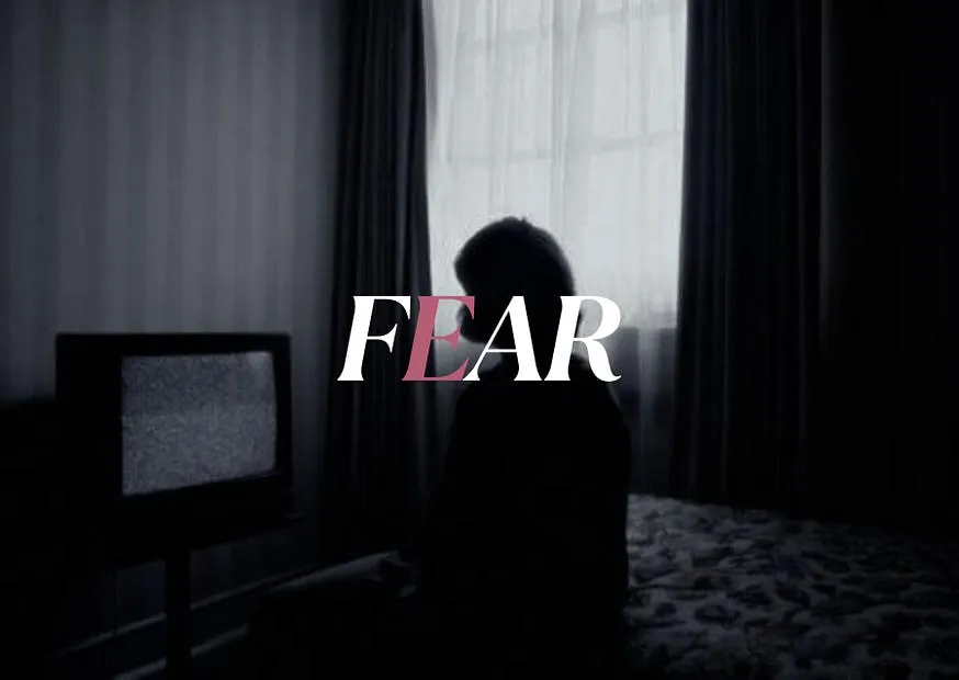 The word FEAR set across a photograph of a figure sitting alone in a dark room, lit only by a switched-on television