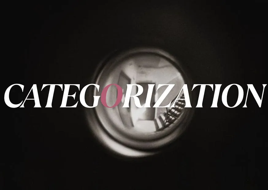 The word CATEGORIZATION set across a photograph looking through a lens, a single bright circle in the darkness